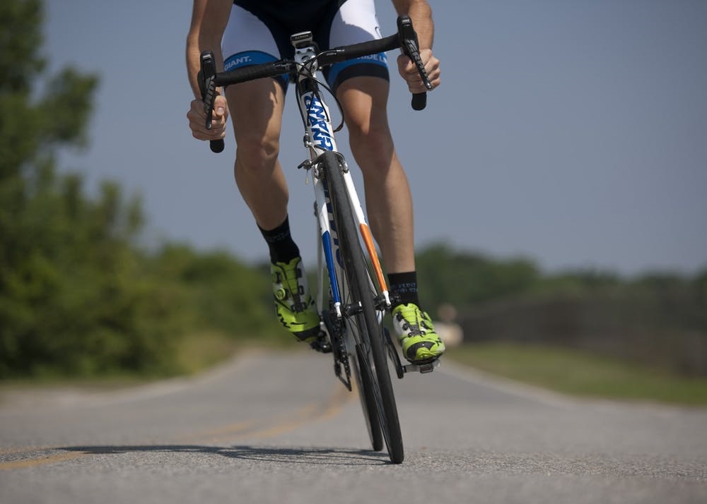 cycling-bicycle-riding-sport-38296 man cycling on road