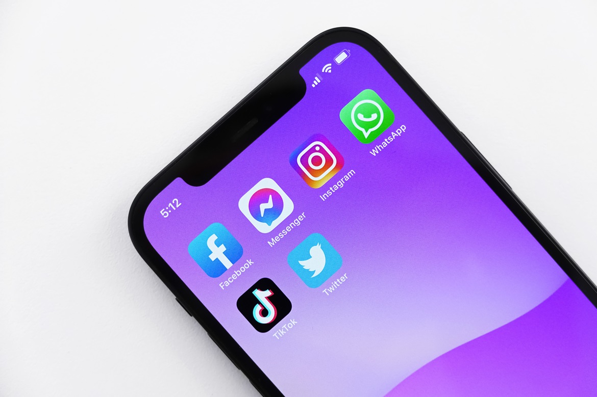 Phone showing various social media icons