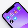 Phone showing various social media icons
