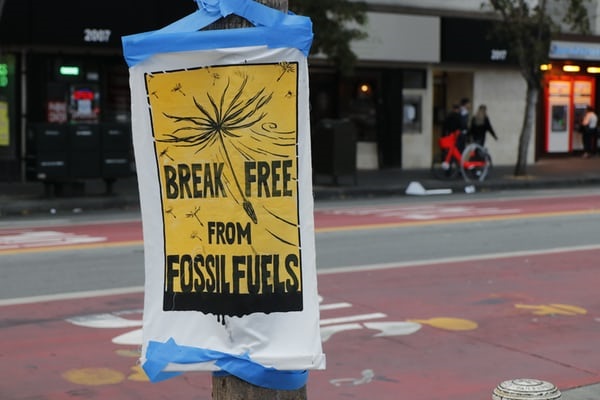 no fossil fuels Sign on post reading 'Break free from fossil fuels'.