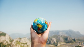 person holding globe