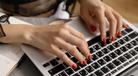 lady typing on laptop