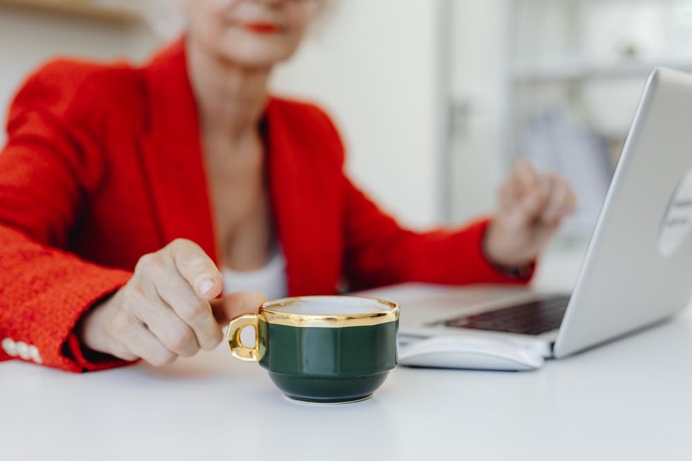 pexels-photo-8530918 woman holding cup of coffee