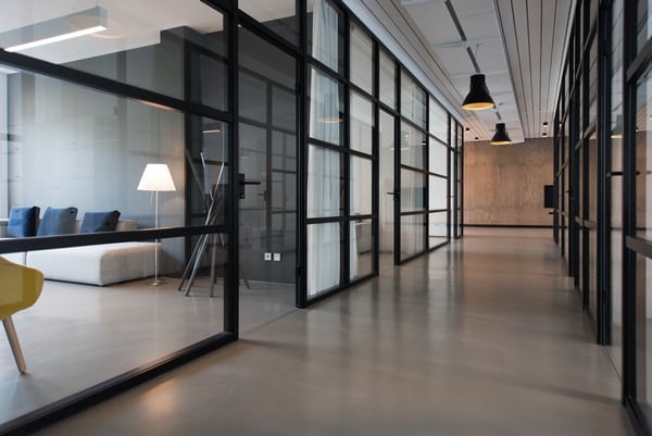 photo-1497366754035-f200968a6e72 Airy and large corridor in office building.