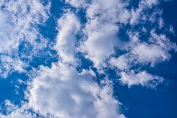 photo-1591345046185-5e8df80dd74c Picture of clouds in blue sky.
