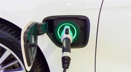 s300_Close_up_of_a_power_supply_connected_to_an_electric_car_via_Smile_Fight_at_Shutterstock