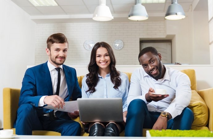 millenials in business millenials in business sat on sofa